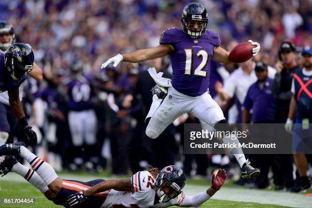 Wide Receiver Michael Campanaro of the Baltimore Ravens returns a punt for a touchdown in the fourth quarter against the Chicago Bears at M&T Bank...