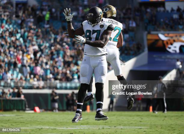 Malik Jackson and Aaron Colvin of the Jacksonville Jaguars celebrate a play in the first half of their game against the Los Angeles Rams at EverBank...