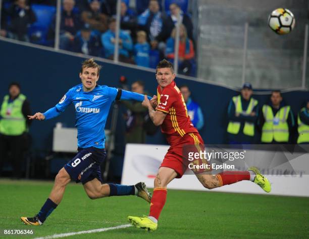 Alexander Kokorin of FC Zenit St. Petersburg vies for the ball with Ilya Maximov of FC Arsenal Tula during the during the Russian Premier League...
