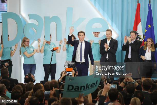 Sebastian Kurz , Austrian Foreign Minister and leader of the conservative Austrian People's Party , greets supporters after initial results give the...