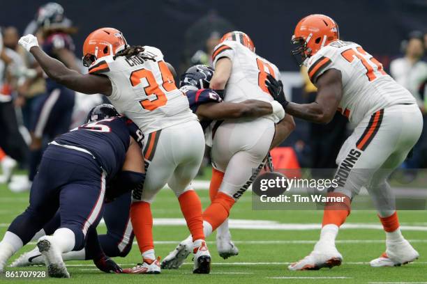 Lamarr Houston of the Houston Texans sacks Kevin Hogan of the Cleveland Browns in the fourth quarter at NRG Stadium on October 15, 2017 in Houston,...