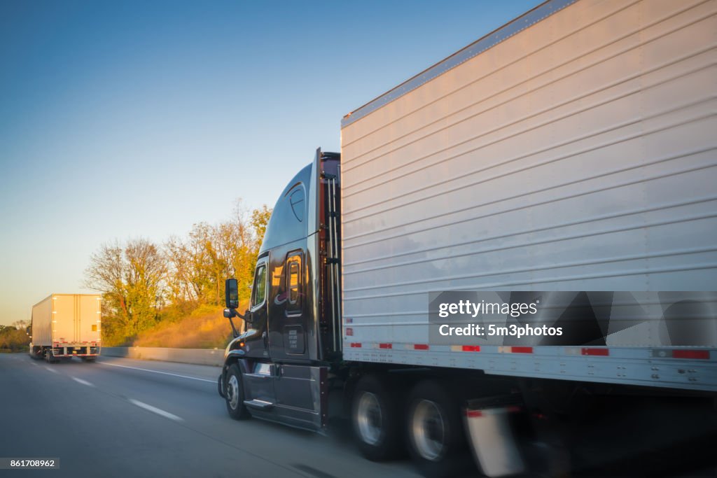 Two trucks on the road