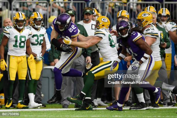 Harrison Smith of the Minnesota Vikings is forced out of bounds by Jordy Nelson of the Green Bay Packers after an interception during the fourth...