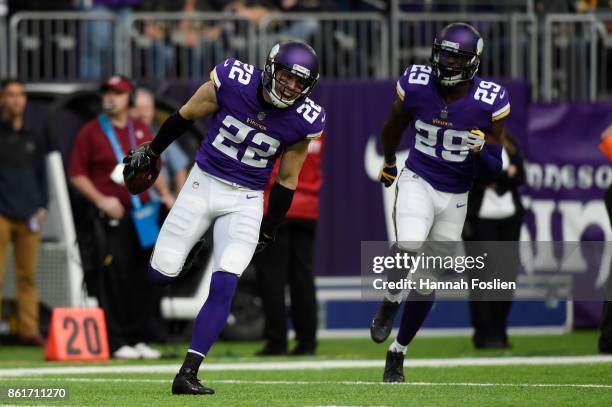 Harrison Smith of and Xavier Rhodes of the Minnesota Vikings celebrate an interception by Smith during the fourth quarter of the game against the...