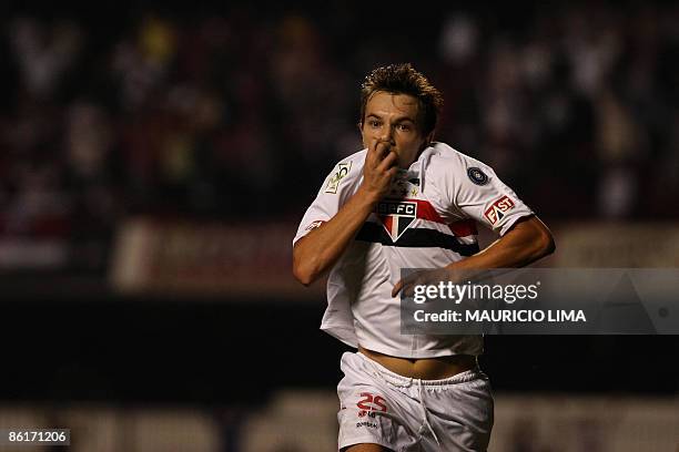 Dagoberto, of Brazil's Sao Paulo FC, celebrates after scoring against Colombia's America de Cali, during their 2009 Libertadores Cup football match...