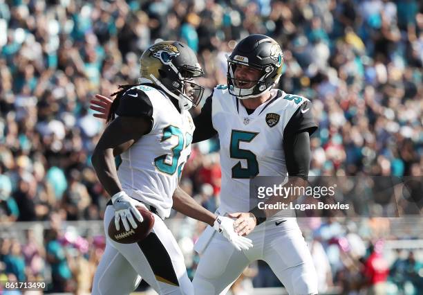 Chris Ivory and Blake Bortles of the Jacksonville Jaguars celebrate after Ivory ran for a 22-yard touchdown in the first half of their game against...