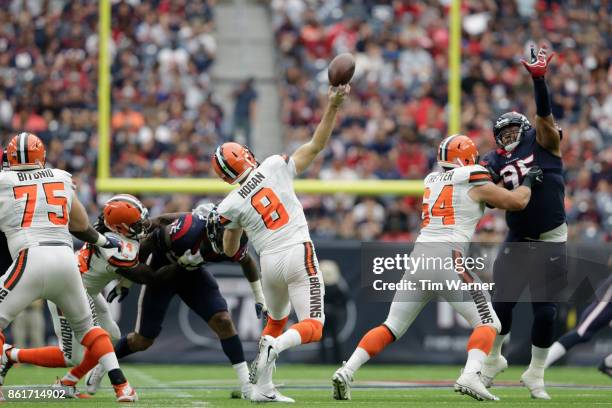 Kevin Hogan of the Cleveland Browns throws a pass in the fourth quarter under pressure by Christian Covington of the Houston Texans and Benardrick...