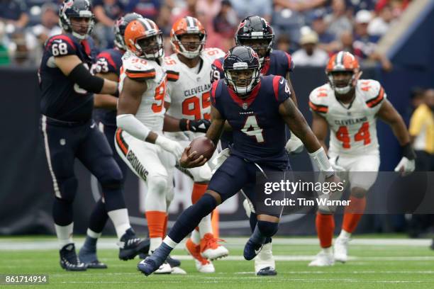 Quarterback Deshaun Watson of the Houston Texans scrambles in the fourth quarter against the Cleveland Browns at NRG Stadium on October 15, 2017 in...