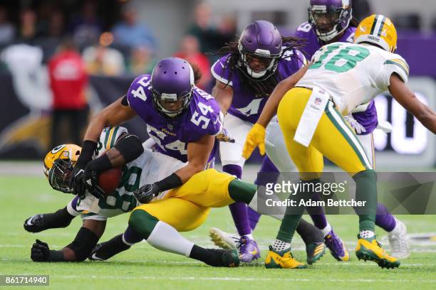 Ty Montgomery of the Green Bay Packers is tackled by Eric Kendricks of the Minnesota Vikings during the fourth quarter of the game on October 15,...