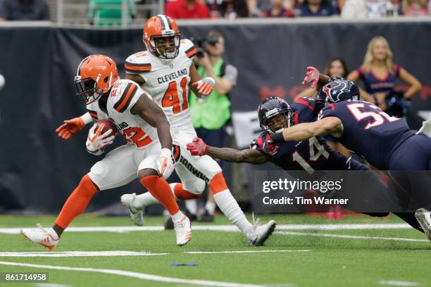 Jabrill Peppers of the Cleveland Browns returns a punt defended by Chris Thompson of the Houston Texans and Brian Peters in the fourth quarter at NRG...