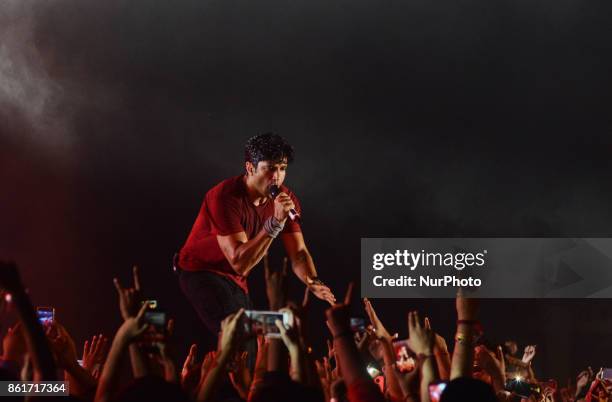 Indian bollywood actor and singer Farhan Akhtar performs during a live concert in Indian Institute of Information Technology , in Allahabad on...