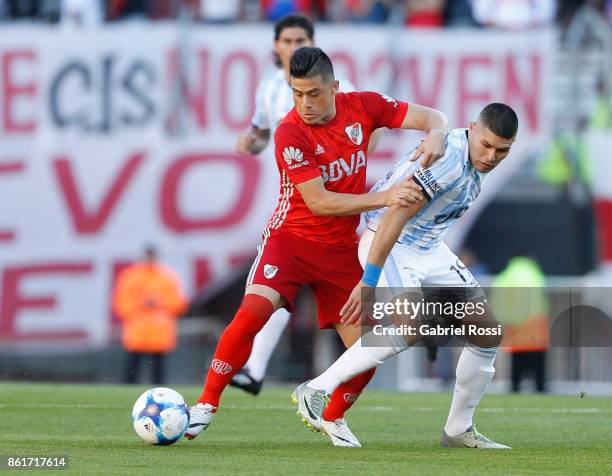 Jorge Luis Moreira of River Plate fights for the ball with David Barbona of Atletico de Tucuman during a match between River Plate and Atletico de...