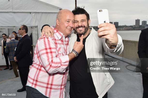 Andrew Zimmern and Adam Richman attend the Food Network & Cooking Channel New York City Wine & Food Festival Presented By Coca-Cola - Coca-Cola...