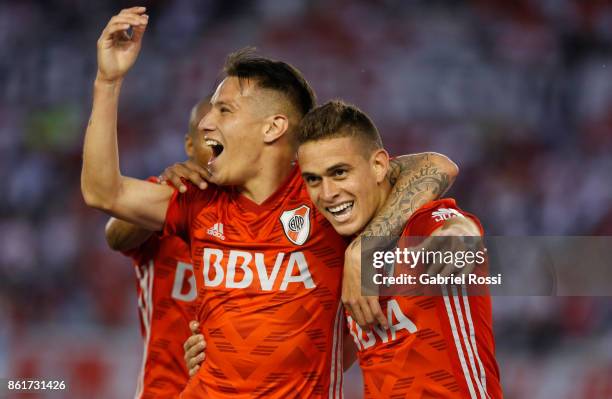 Rafael Santos Borre of River Plate celebrates with teammates Carlos Auzqui and Nicolas De La Cruz after scoring the second goal of his team during a...