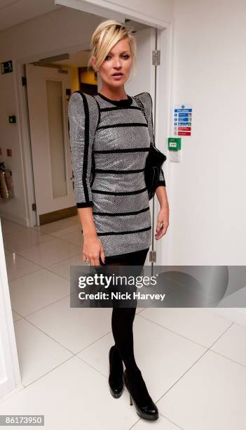 Model Kate Moss attends the unveiling of the 'White Light' diamond brooch designed by Shaun Leane at Millbank Tower on April 22, 2009 in London,...