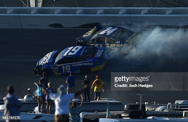 Chase Elliott, driver of the NAPA Chevrolet, and Daniel Suarez, driver of the Camping World Toyota, are involved in an on-track incident during the...