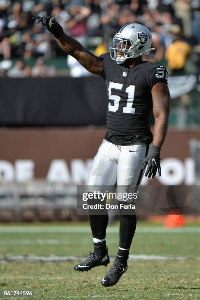 Bruce Irvin of the Oakland Raiders reacts to a play against the Los Angeles Chargers during their NFL game at Oakland-Alameda County Coliseum on...