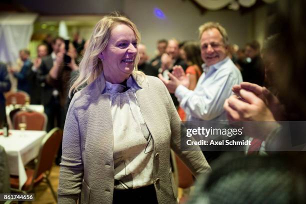 Dana Guth, top candidate of Germany's far right AfD party celebrates with supporters following initial results that give the AfD a finish with 6.2%...