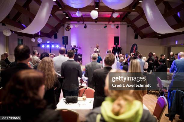 Dana Guth, top candidate of Germany's far right AfD party celebrates with supporters following initial results that give the AfD a finish with 6.2%...