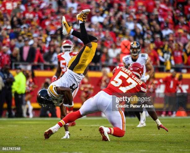 Wide receiver Antonio Brown of the Pittsburgh Steelers is upended by linebacker Kevin Pierre-Louis of the Kansas City Chiefs after a catch over the...