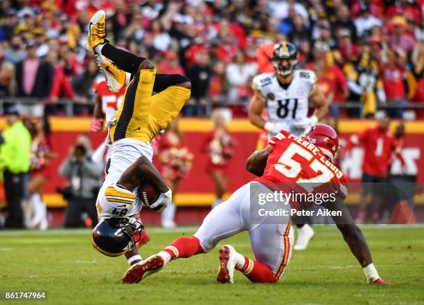 Wide receiver Antonio Brown of the Pittsburgh Steelers is upended by linebacker Kevin Pierre-Louis of the Kansas City Chiefs after a catch over the...