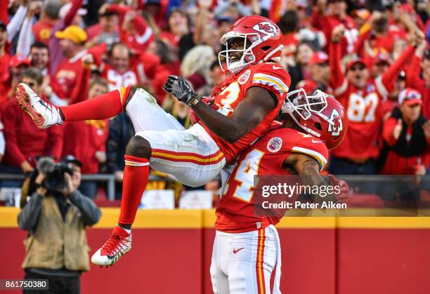 Wide receiver De'Anthony Thomas of the Kansas City Chiefs celebrates a touchdown with teammate Demarcus Robinson during the fourth quarter of the...