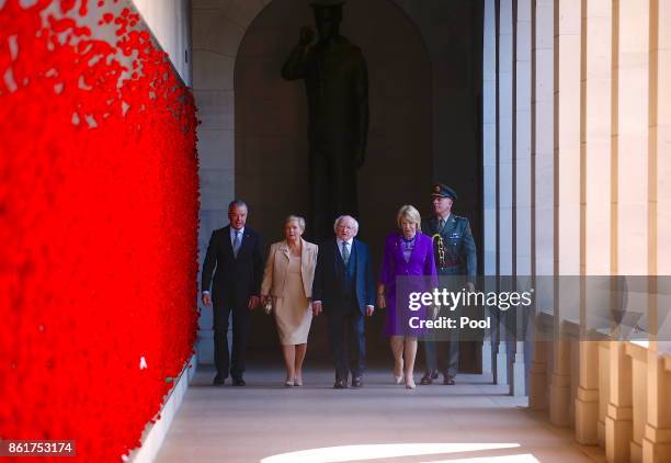 The President of Ireland, Michael Higgins, walks with his wife Sabina, Brendan Nelson, Director of the Australian War Memorial, and Frances...