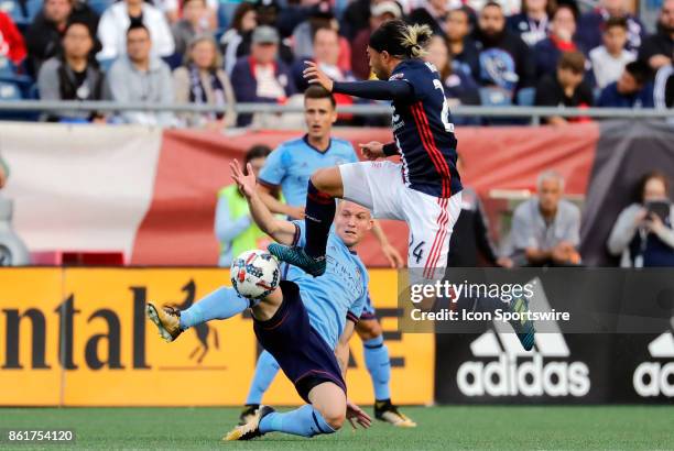 New York City FC midfielder Alexander Ring and New England Revolution midfielder Lee Nguyen contest a ball during a match between the New England...