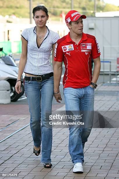 Casey Stoner of Australia and Ducati Marlboro Team arrives with his wife Adriana Stoner to attend a press conference for the MotoGP World...