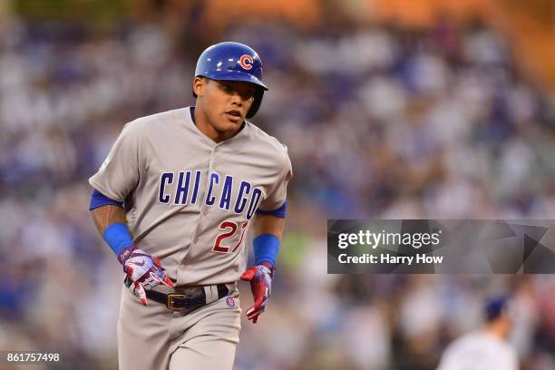 Addison Russell of the Chicago Cubs runs the bases after hitting a solo home run in the fifth inning against the Los Angeles Dodgers during game two...