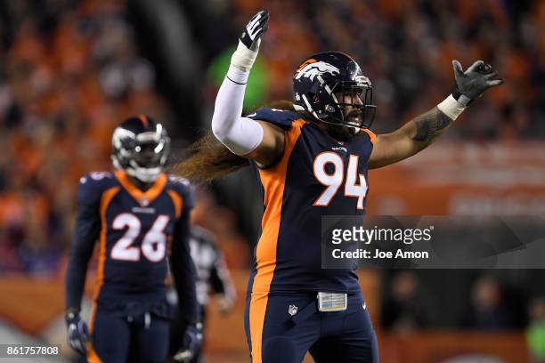 Domata Peko of the Denver Broncos tries to pump up the crowd during the first quarter of the game against the New York Giants. The Denver Broncos...
