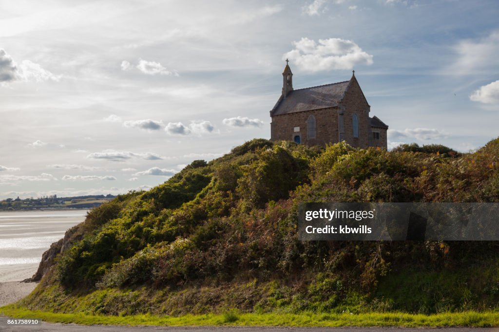 Sunny Chapel of St Maurice overlooking the Anse de Morieux