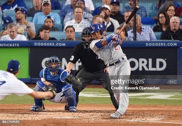 Addison Russell of the Chicago Cubs hits a solo home run in the fifth inning against the Los Angeles Dodgers during game two of the National League...