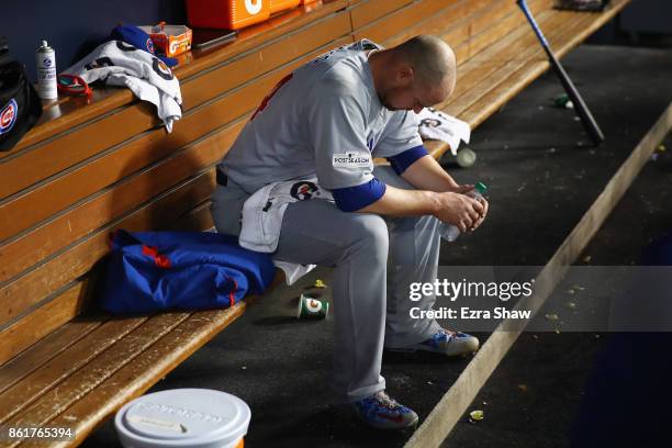 Jon Lester of the Chicago Cubs sits in the dugout after pitching during the fifth inning against the Los Angeles Dodgers in Game Two of the National...