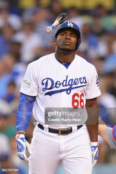 Yasiel Puig of the Los Angeles Dodgers tosses his bat after missing a swing in the fourth inning against the Chicago Cubs during game two of the...