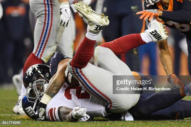 Orleans Darkwa of the New York Giants and Dalvin Tomlinson of the New York Giants get tangled up on the ground during the third quarter of the on...
