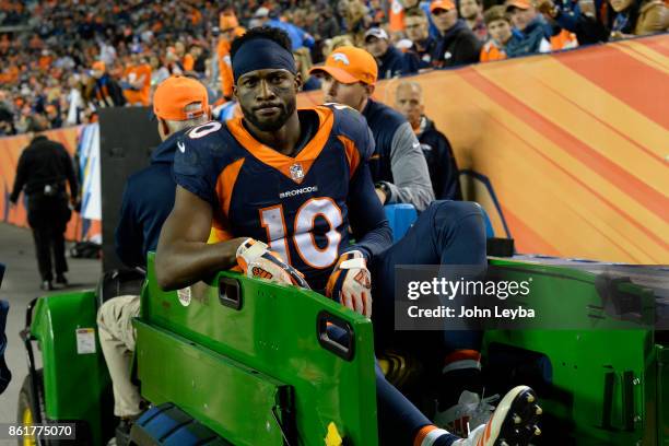 Emmanuel Sanders of the Denver Broncos is carted off the field in the third quarter against the New York Giants. The Denver Broncos hosted the New...