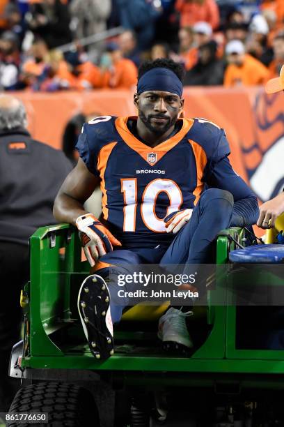 Emmanuel Sanders of the Denver Broncos is carted off the field in the third quarter against the New York Giants. The Denver Broncos hosted the New...