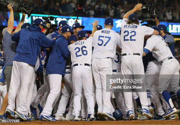 The Los Angeles Dodgers celebrate after Justin Turner hits the winning home run in the bottom of the ninth inning making the score 4-1 during Game...