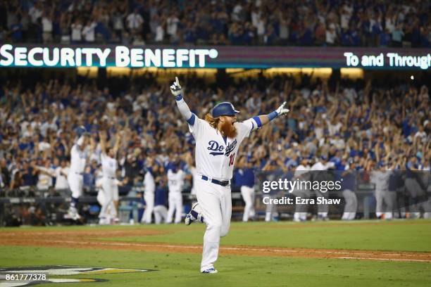 Justin Turner of the Los Angeles Dodgers celebrates after hitting the winning home run in the bottom of the ninth inning making the score 4-1 during...