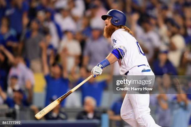 Justin Turner of the Los Angeles Dodgers reacts after hitting a three-run walk-off home run in the ninth inning to defeat the Chicago Cubs 4-1 in...