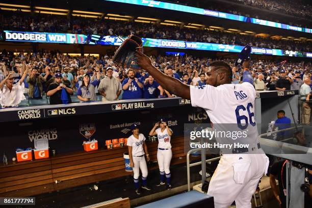 Yasiel Puig of the Los Angeles Dodgers waves to fans after defeating the Chicago Cubs 4-1 in game two of the National League Championship Series at...