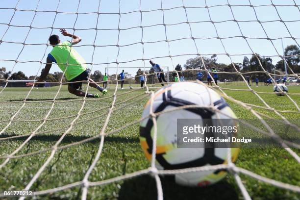 Tim Cahill of the City fails as goal keeper against City goalkeeper Dean Bouzanis who takes a penalty kick during a Melbourne City A-League training...