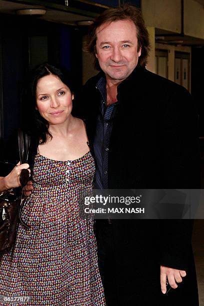 Irish singer and actress Andrea Corr poses for photographs with her co-star Neil Pearson, as they arrive for the premiere of their latest film...