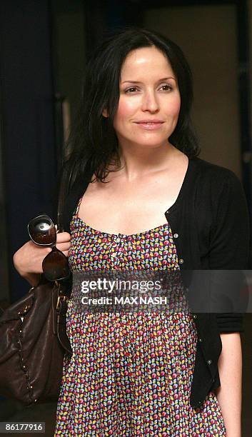 Irish singer and actress Andrea Corr poses for photographs with her co-star Neil Pearson, as she arrives for the premiere of her latest film...