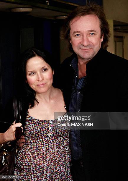 Irish singer and actress Andrea Corr poses for photographs with her co-star Neil Pearson, as they arrive for the premiere of their latest film...