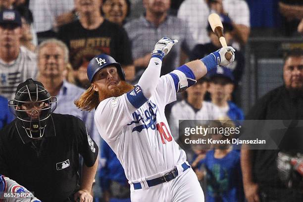 Justin Turner of the Los Angeles Dodgers hits a three-run walk-off home run in the ninth inning to defeat the Chicago Cubs 4-1 in game two of the...