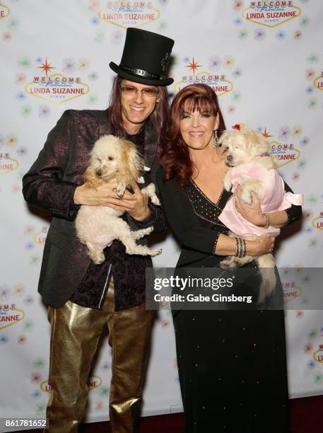 Band leader John Wakerman and his wife, singer Linda Suzanne, pose with rescue dogs from Friends for Life Humane Society at the debut of "Linda...