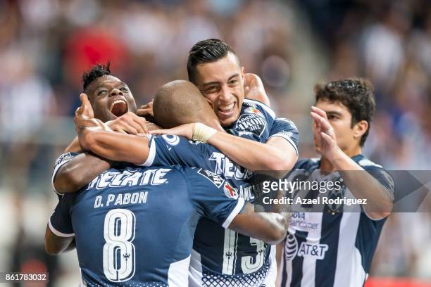 Aviles Hurtado of Monterrey celebrate with teammates after scoring his team's second goal during the 13th round match between Monterrey and Pachuca...