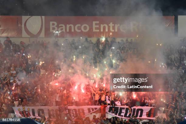 Fans of Patronato light flares to cheer their team during a match between Patronato and Boca Juniors as part of Superliga 2017/18 at Presbitero...